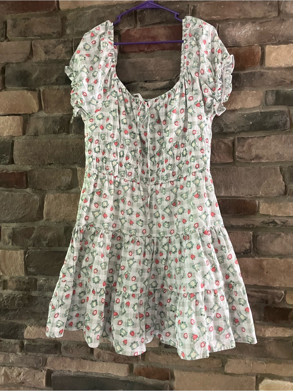 Hot Topic tiered babydoll dress featuring a green frog and strawberry